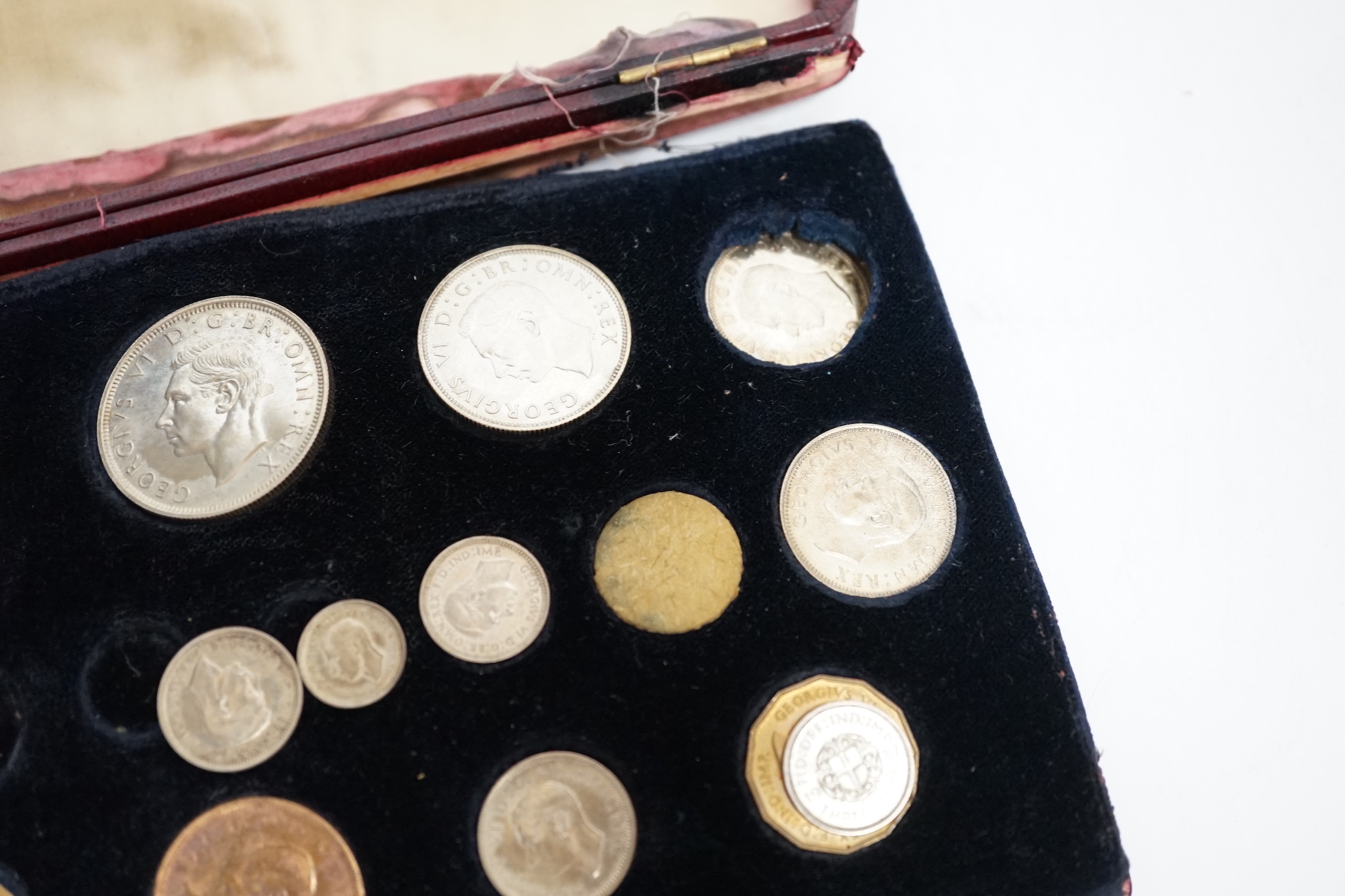 A 9 carat gold cigar cutter, silver pendant and a George VI specimen coin set a/f
